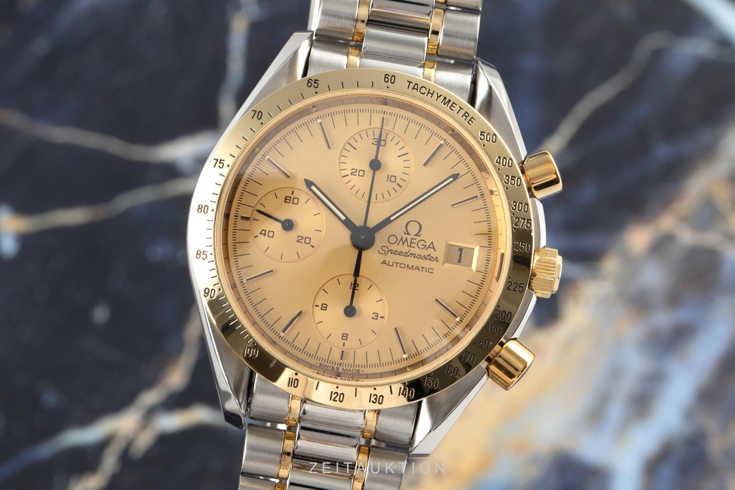 omega speedmaster automatic gold