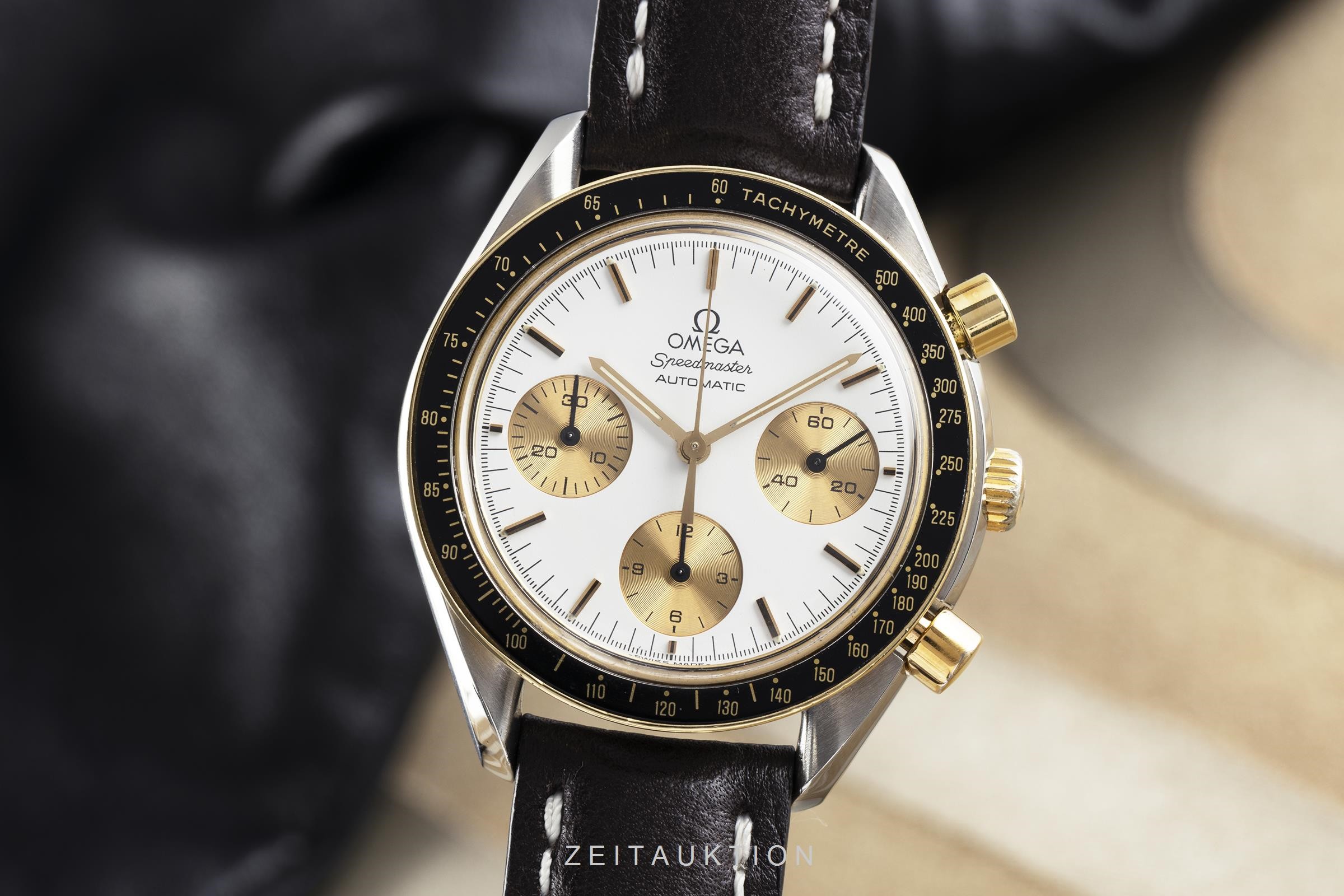omega speedmaster automatic oro