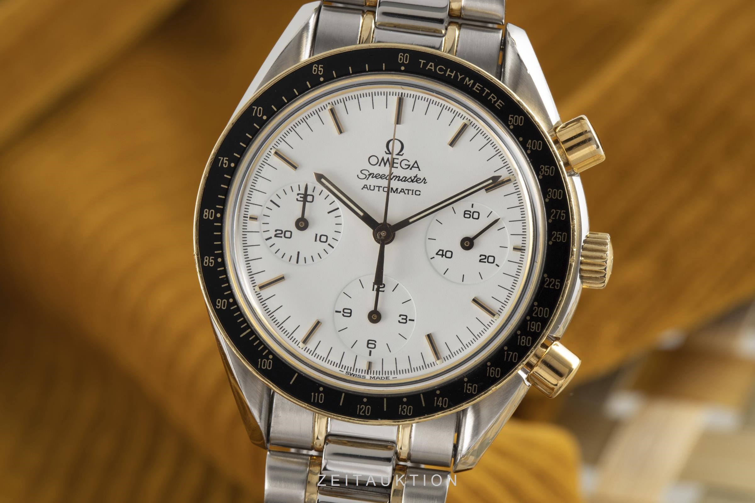 omega speedmaster automatic oro