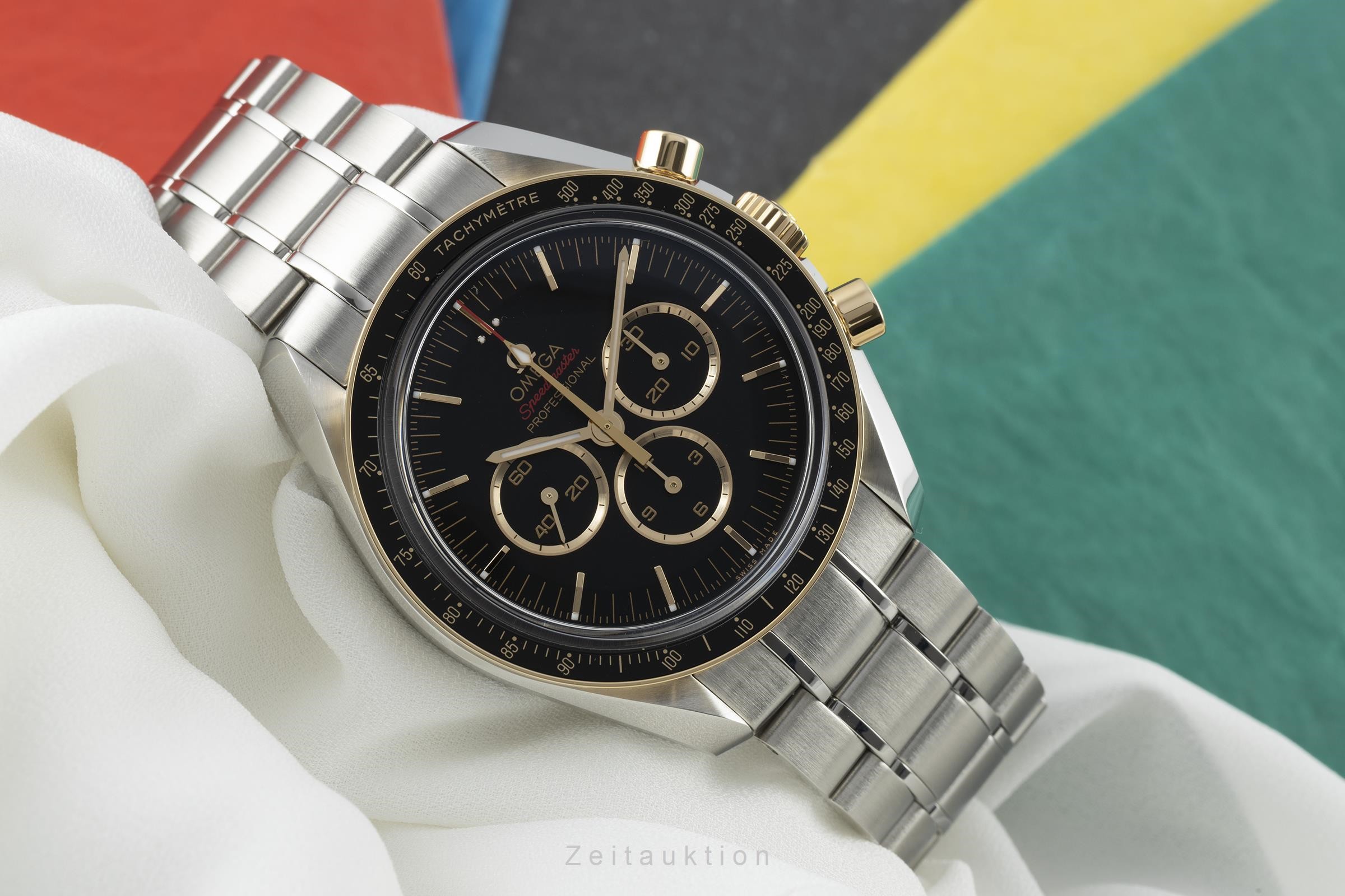 omega speedmaster steel gold